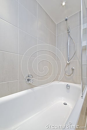 Bath tub with shower attachment Stock Photo