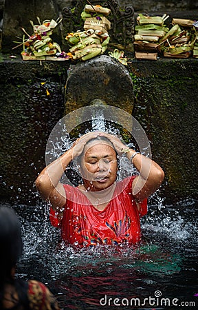 A Bather at the tirta empul fountains in bali 2 Editorial Stock Photo
