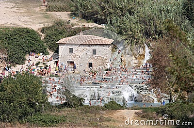 Bathers in the springs of Terme di Saturnia, Italy Editorial Stock Photo