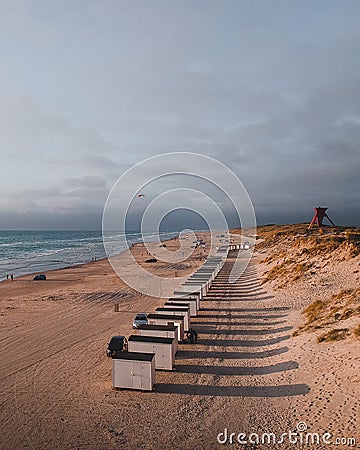 The bathing huts at Blokhus Beach, Denmark during sunset. Stock Photo