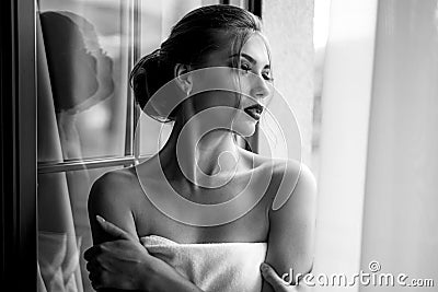 Bathrobe woman. Elegant beautiful woman with perfect make up. Beautiful sexy young woman. Fashion photo. Stock Photo