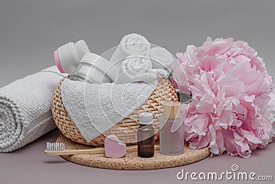 Bathroom accessories on the table, towels, white towels for face and body, toothbrush, cosmetic set, face and body care Stock Photo