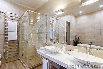 Bathroom of the hotel rooms, with a shower and a few washbasins Stock Photo