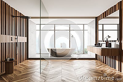 Bathroom interior with bathtub and shower, sink with view on countryside Stock Photo