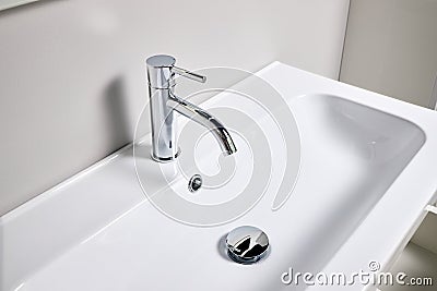 Bathroom interior modern design sink. Interior of bathroom with washbasin and faucet elongated rectangular shape bowl. Stock Photo