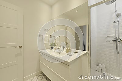 Bathroom with one-piece white porcelain sink, large frameless wall mirror Stock Photo