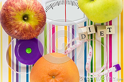 Bathroom scale with fruits and diet text Stock Photo