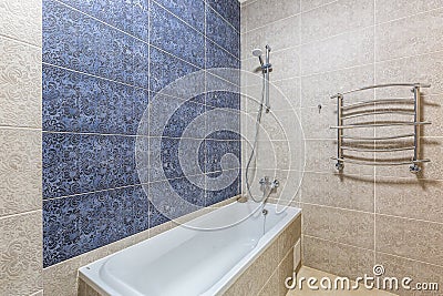 Bathroom with shower, bathtub and light tiles Stock Photo