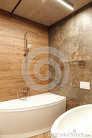 Bathroom in a style loft with wood and stone tiles Stock Photo