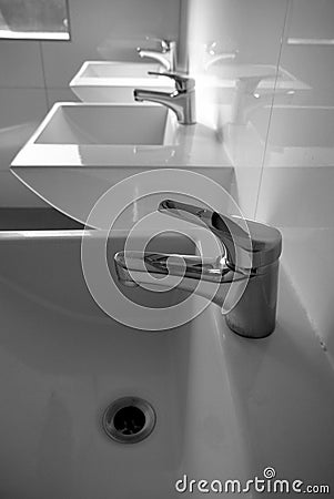 Bathroom: three modern white basins Stock Photo