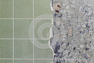 Bathroom tiles wall besides cracked and destroyed undersurface Stock Photo