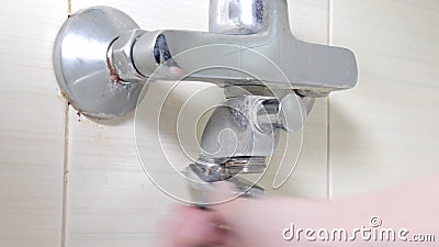 Bathtub Faucet Reparing Unscrewing A Nut On A Leaky Shower Hose