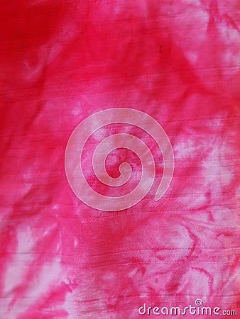 Batic or batik technique dyed silky cloths in bright magenta color and abstract pattern Stock Photo