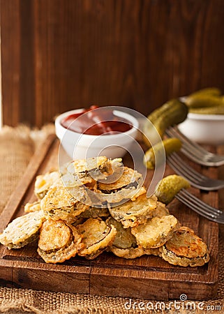 Battered fried pickles with ketchup Stock Photo