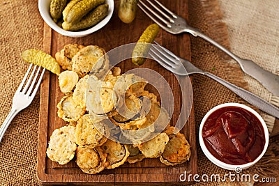 Battered fried pickles with ketchup Stock Photo