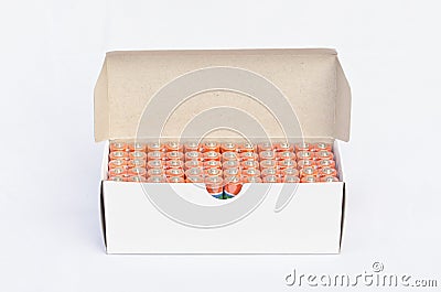 Batteries in a row into box Stock Photo