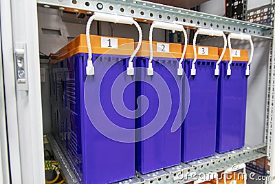 Batteries in the server`s uninterruptible power supply unit to supply power to the server during the shutdown phase, rows of Stock Photo