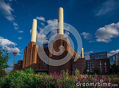 Battersea, London, UK: Battersea Power Station north facade with flowers Editorial Stock Photo