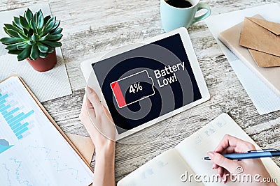 Battery low message on mobile device screen. Internet and technology concept. Stock Photo