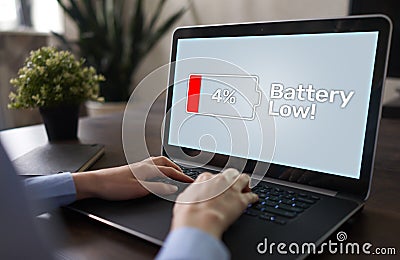 Battery low message on mobile device screen. Internet and technology concept. Stock Photo