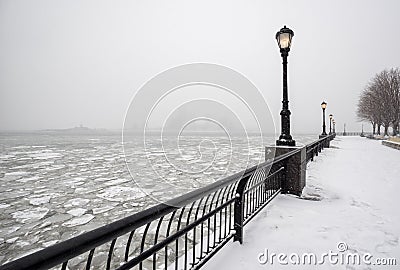 Battery Park under snow with frozen Hudson River, New York Stock Photo