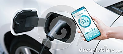 Battery status interface on smartphone for progressive future refueling concept. Stock Photo