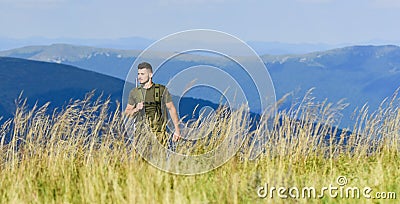 Battle field. man ready to fire. hunter hobby. army forces. sniper reach target mountain. muscular man hold weapon Stock Photo