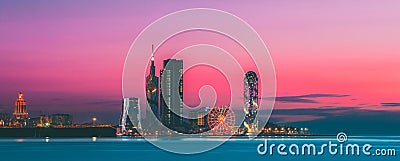 Batumi, Adjara, Georgia. Panorama of Illuminated Resort Town at Sunset Stock Photo