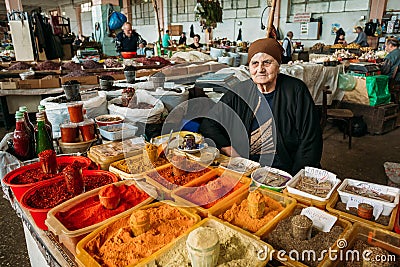 Elderly Georgian Woman, Seller Of Spices Is Waiting For Buyers At The Counter Editorial Stock Photo
