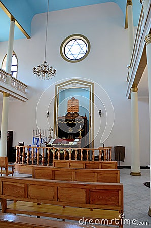 Interior of Jewish synagogue with Star of David pews altar menorah hanukkah candle Batumi Georgia Editorial Stock Photo
