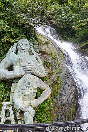 Batumi, Georgia â€“ September, 2021: Andrew the First-Called waterfall and statue, near the village of Sarpi in the Ajara, Georgia Editorial Stock Photo