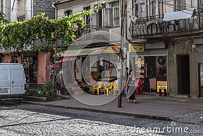 Batumi. Georgia - September 2, 2014. Small authentic Batumi street with a small market and a cafe. Editorial Stock Photo