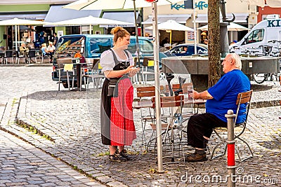 Bavarian waitress outdoors Editorial Stock Photo