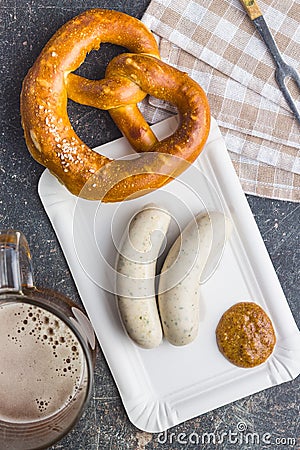 The bavarian weisswurst, pretzel and mustard. Stock Photo