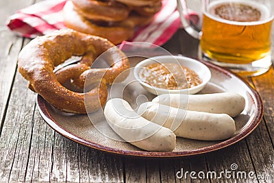 The bavarian weisswurst, pretzel and mustard. Stock Photo