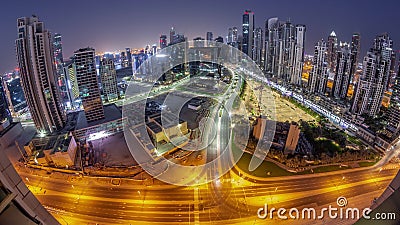 Bay Avenue with modern towers residential development in Business Bay aerial panoramic night to day timelapse, Dubai Editorial Stock Photo
