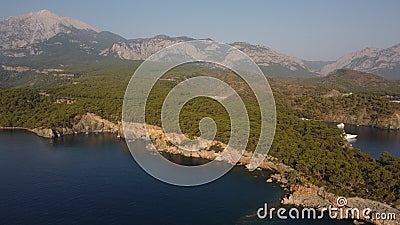 A bay Cennet Koyu with a Tahtal? Dagi mountain and Kemer view from a drone. Stock Photo