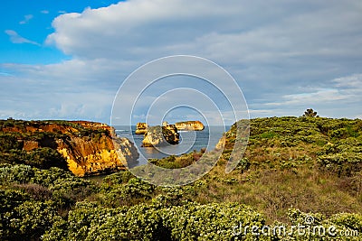 Bay of Islands on the Great Ocean Road. Rock formation in the ocean. Rocks covered by bushes. Australia landscape. Victoria, Stock Photo