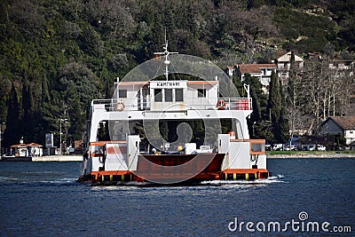 Bay of Kotor, Montenegro. Car Ferry at the Bay of Kotor, in the Verige strait, between the villages of Kamenari and Lepetane. Editorial Stock Photo