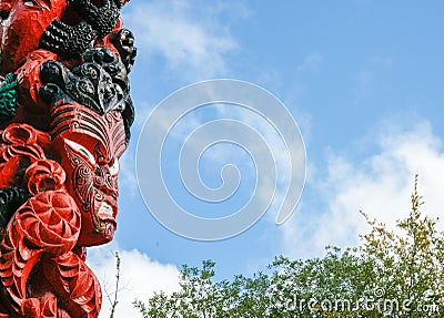 Fearsome Maori totem pole or pouwhenua Editorial Stock Photo