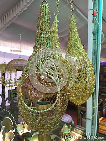 Baya weaver nest shape metallic hanging show piece in a handicraft market in India Stock Photo