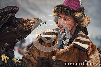 Bayan-Olgii, Mongolia - October 01, 2017: Festival Of Hunters With Golden Eagles. Portrait Of Unfamiliar Mongolian Hunter With Ber Editorial Stock Photo