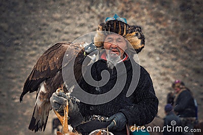 Bayan-Olgii, Mongolia - October 01, 2017: Golden Eagle Festifal. Portrait Of Picturesque Old Greybearded Mongolian Hunter Berkutch Editorial Stock Photo