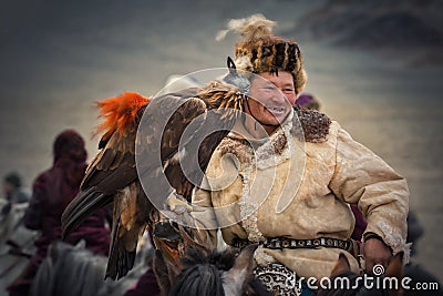 Bayan-Olgiy aimag, Western Mongolia - October 07,2018: Nomad Games, Altai Eagle Festival.Hunter With Silver Teeth Celebrating Vict Editorial Stock Photo
