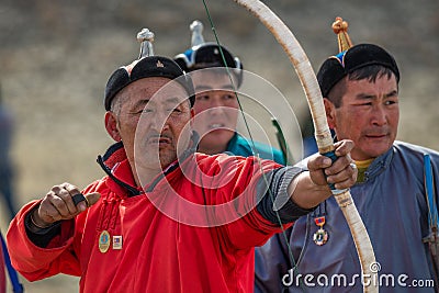 Bayan-Ulgii, Mongolia - October 01, 2017: Traditional Golden Eagle Festival, Archery Competitions. Unknown Bowman In Red Robe Editorial Stock Photo