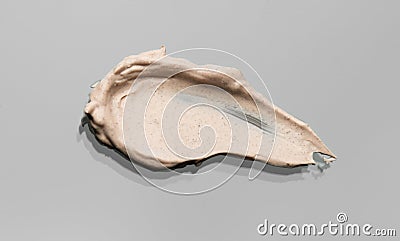 Bb cream smear makeup, cosmetic product over gray background. Make up base skin care, foundation Stock Photo