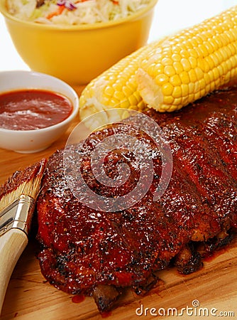 BBQ Ribs with cole slaw, corn and dipping sauce Stock Photo