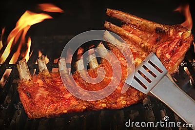 BBQ Roasted Baby Back Pork Ribs On Hot Flaming Grill Stock Photo