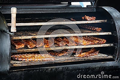 Bbq spareribs in barbecue smoker Stock Photo