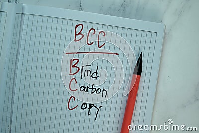 BCC - Blind Carbon Copy write on a book isolated on Wooden Table Stock Photo